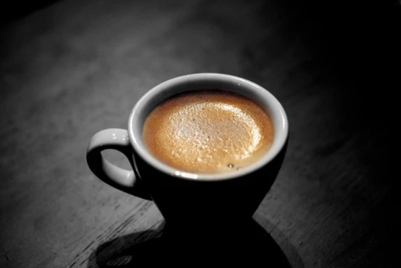 close up shot of coffee in a white cup