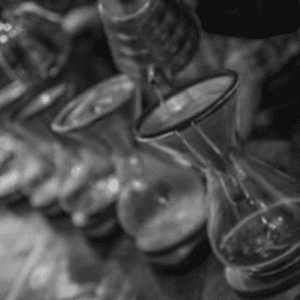 coffee being poured into decanters