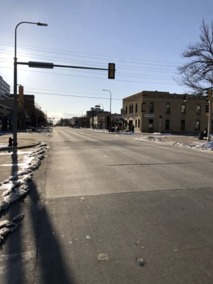 picture of the empty road in front of Essence of Coffee